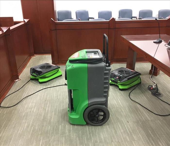 Drying equipment in courtroom.